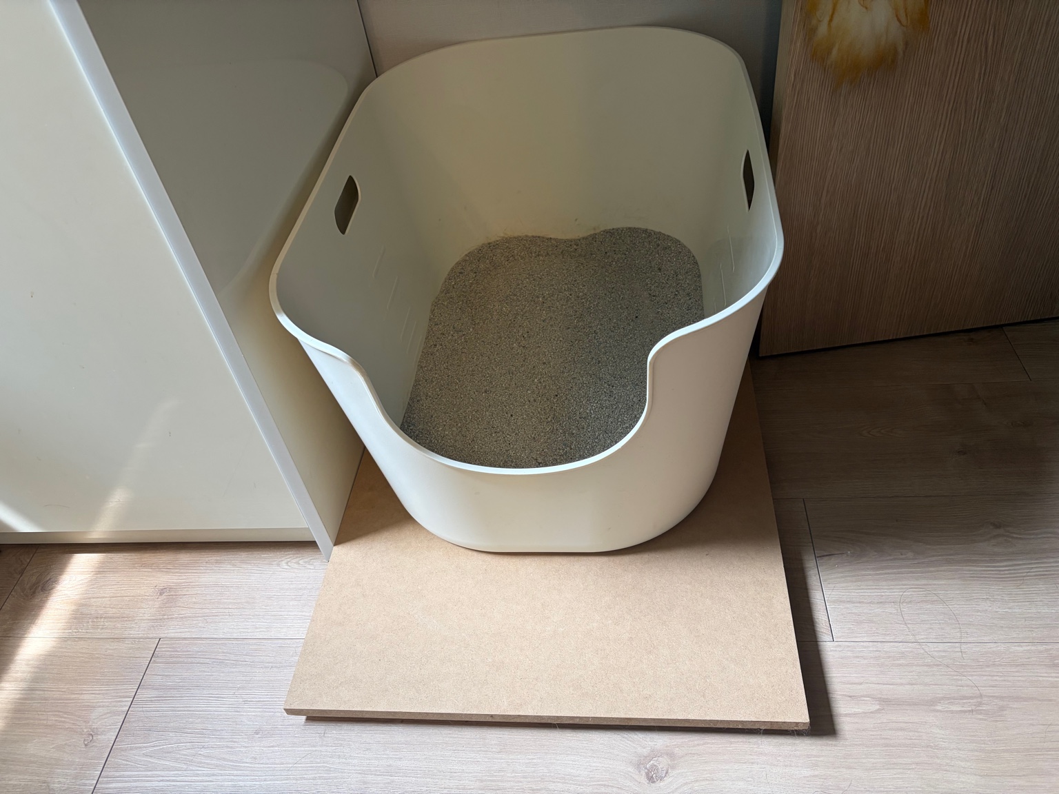 Litter box placed on a large pad prototype